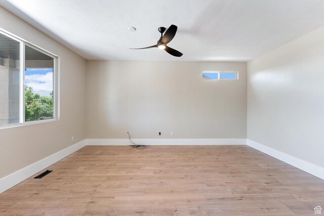 8743 N Franklin Dr E, Eagle Mountain, UT 84005 - empty room featuring a ceiling fan and light wood-type flooring