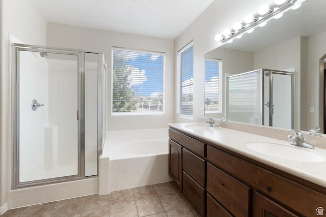 8743 N Franklin Dr E, Eagle Mountain, UT 84005 - full bathroom featuring a stall shower, double vanity, a garden tub, and tile patterned flooring