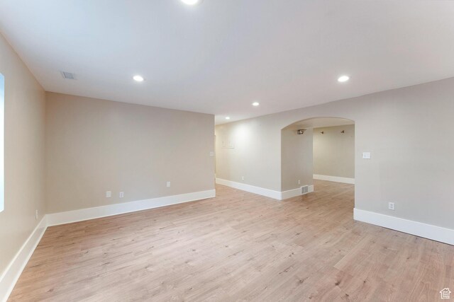 8743 N Franklin Dr E, Eagle Mountain, UT 84005 - spare room featuring recessed lighting, arched walkways, and light wood finished floors