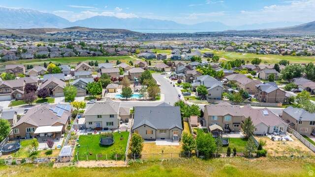 8743 N Franklin Dr E, Eagle Mountain, UT 84005 - aerial perspective of suburban area featuring a mountain backdrop