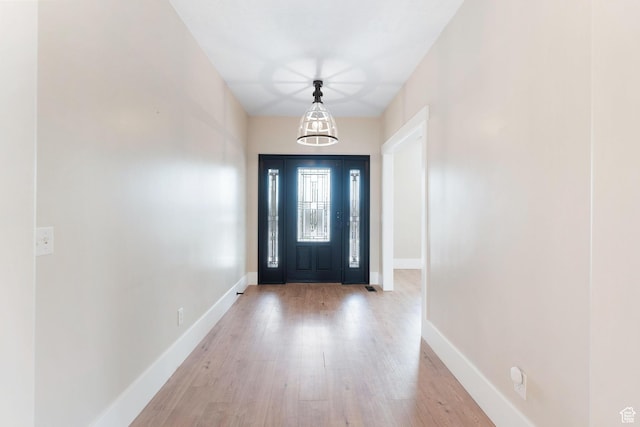 8743 N Franklin Dr E, Eagle Mountain, UT 84005 - foyer entrance featuring light wood-type flooring and baseboards