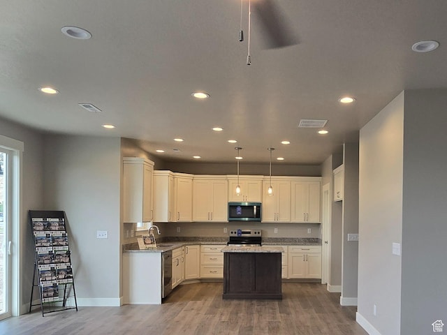442 W 1325 N Unit 25, Brigham City, UT 84302 - kitchen featuring appliances with stainless steel finishes, wood finished floors, recessed lighting, a kitchen island, and light stone countertops