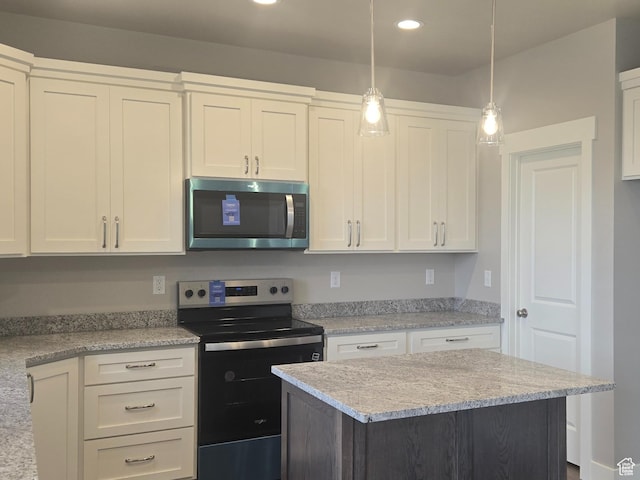442 W 1325 N Unit 25, Brigham City, UT 84302 - kitchen featuring appliances with stainless steel finishes, recessed lighting, white cabinetry, decorative light fixtures, and a kitchen island