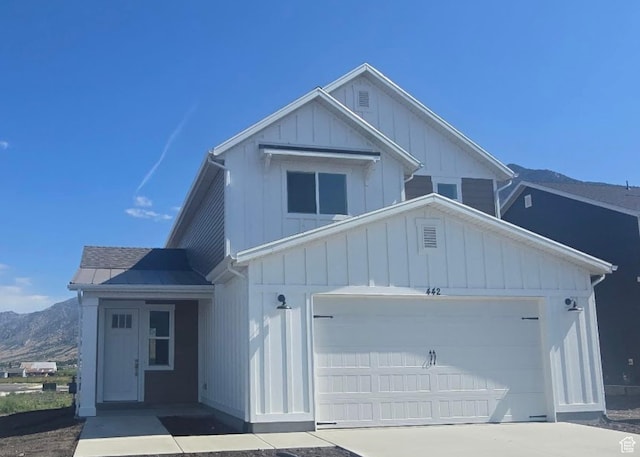442 W 1325 N Unit 25, Brigham City, UT 84302 - view of front of property with board and batten siding, a mountain view, and driveway