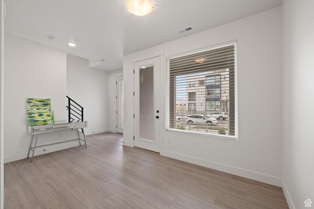 11079 S Lake Run Rd, South Jordan, UT 84009 - foyer entrance featuring wood finished floors and stairway
