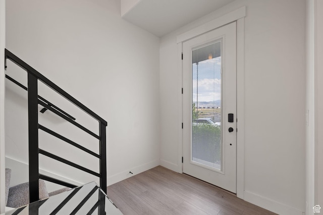 11079 S Lake Run Rd, South Jordan, UT 84009 - foyer featuring light wood-style flooring, plenty of natural light, and stairway