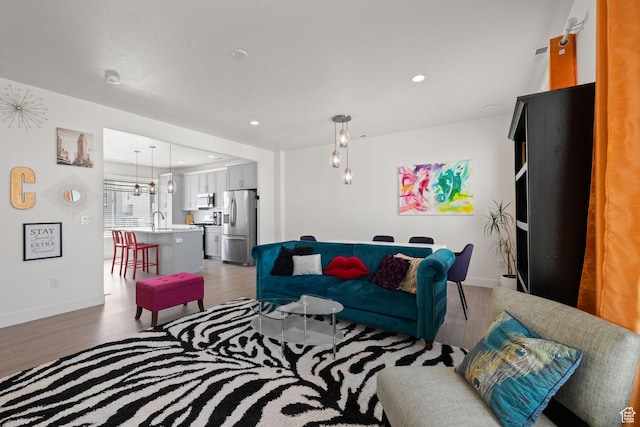 11079 S Lake Run Rd, South Jordan, UT 84009 - living room with light wood-style flooring and recessed lighting