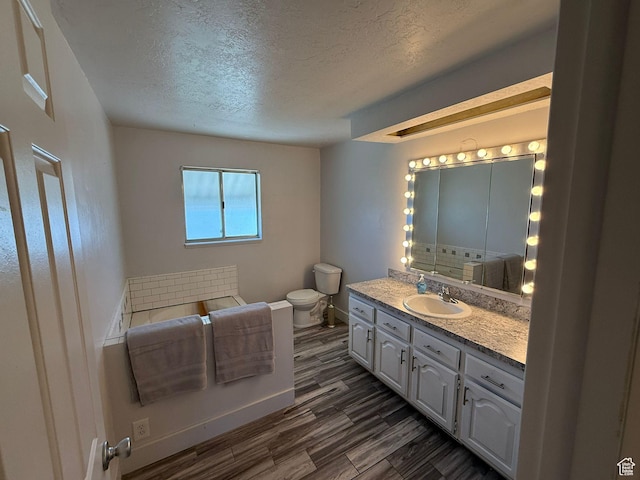 5509 S 2150 W, Roy, UT 84067 - bathroom with a textured ceiling, vanity, and wood finished floors
