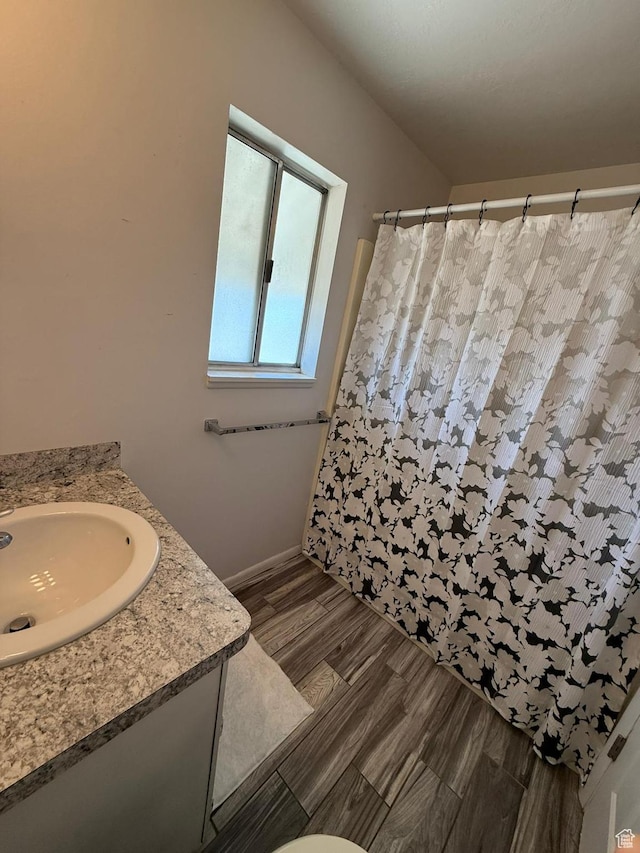 5509 S 2150 W, Roy, UT 84067 - bathroom featuring vanity, curtained shower, and wood finished floors