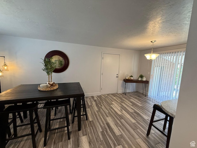 5509 S 2150 W, Roy, UT 84067 - dining room with dark wood-style floors and a textured ceiling