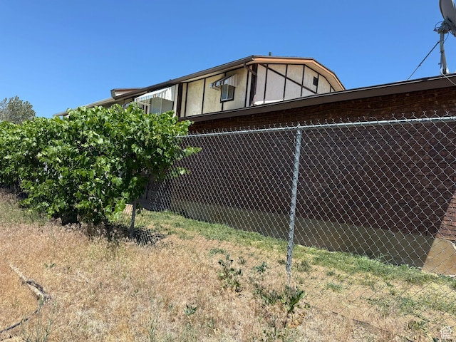 5509 S 2150 W, Roy, UT 84067 - view of side of home featuring brick siding