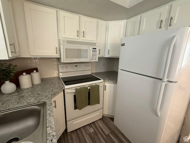 5509 S 2150 W, Roy, UT 84067 - kitchen featuring white appliances, dark wood finished floors, white cabinets, decorative backsplash, and light stone counters