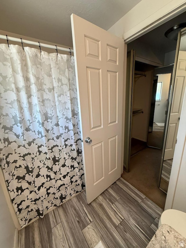 5509 S 2150 W, Roy, UT 84067 - full bath featuring a shower with curtain and wood finished floors