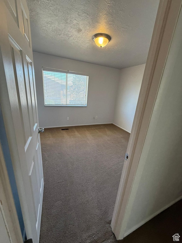 5509 S 2150 W, Roy, UT 84067 - carpeted empty room featuring a textured ceiling