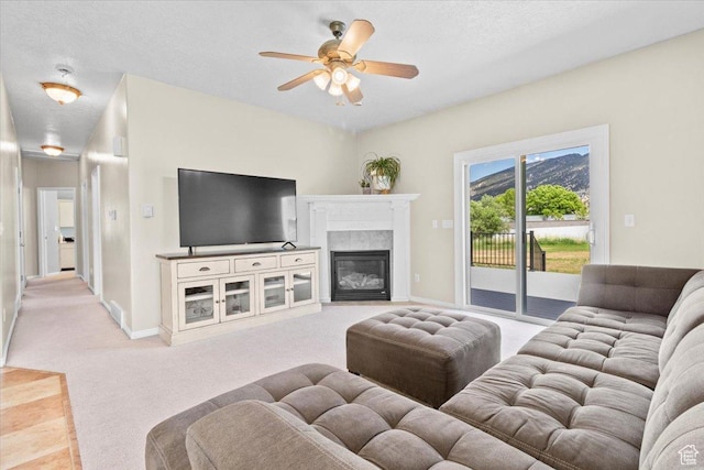 231 S 200 E, Manti, UT 84642 - living room featuring light colored carpet, ceiling fan, and a fireplace