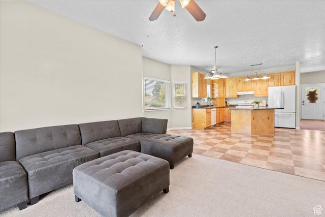 231 S 200 E, Manti, UT 84642 - living room featuring ceiling fan, a textured ceiling, and light flooring
