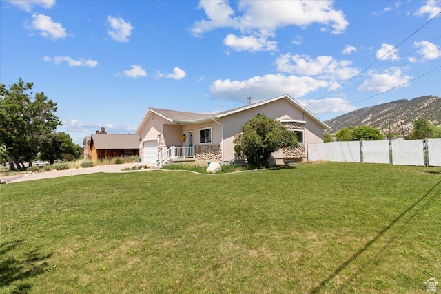 231 S 200 E, Manti, UT 84642 - view of front facade featuring driveway, a garage, stucco siding, and a mountain view