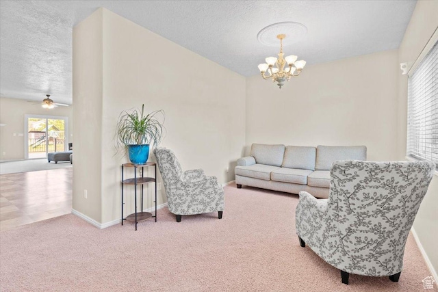 231 S 200 E, Manti, UT 84642 - carpeted living area featuring a chandelier, a textured ceiling, plenty of natural light, and ceiling fan