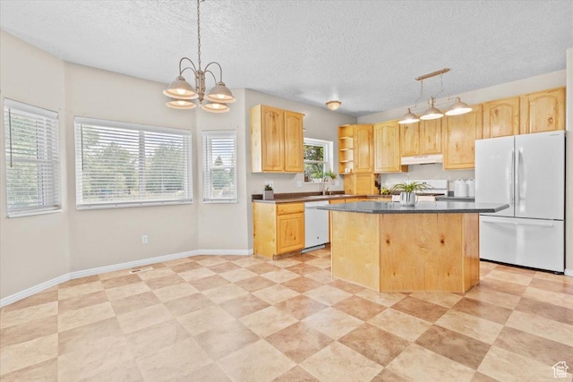 231 S 200 E, Manti, UT 84642 - kitchen featuring freestanding refrigerator, light brown cabinets, dark countertops, and a textured ceiling