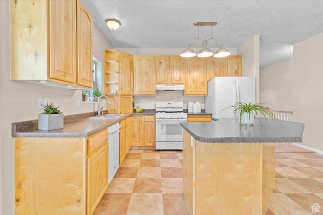 231 S 200 E, Manti, UT 84642 - kitchen with white appliances, light brown cabinetry, dark countertops, under cabinet range hood, and a kitchen island