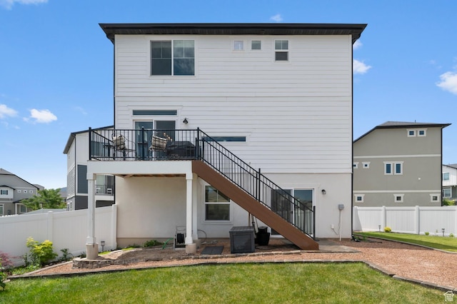 106 E Polaris Dr, Saratoga Springs, UT 84045 - back of property with stairway and a fenced backyard