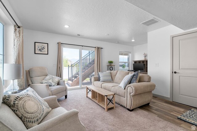 106 E Polaris Dr, Saratoga Springs, UT 84045 - living room featuring recessed lighting, a textured ceiling, and wood finished floors