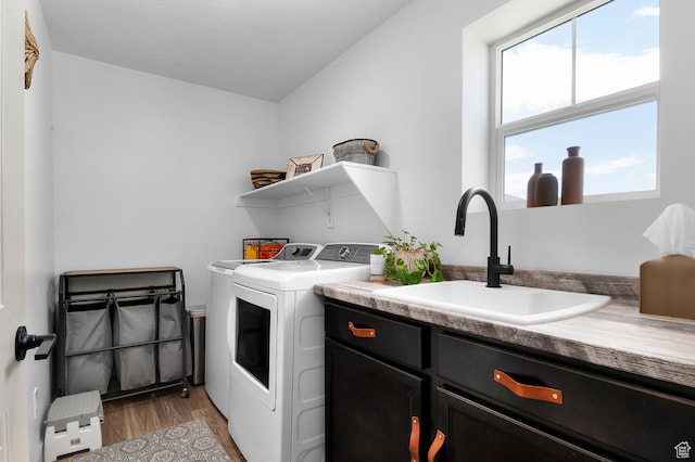 106 E Polaris Dr, Saratoga Springs, UT 84045 - laundry room featuring independent washer and dryer, cabinet space, and wood finished floors