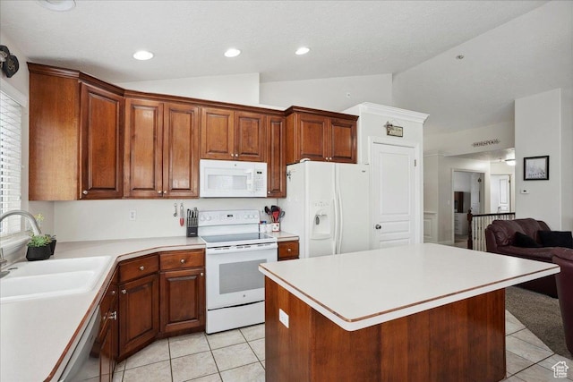 3634 N 225 E, North Ogden, UT 84414 - kitchen featuring white appliances, light tile patterned floors, vaulted ceiling, light countertops, and open floor plan