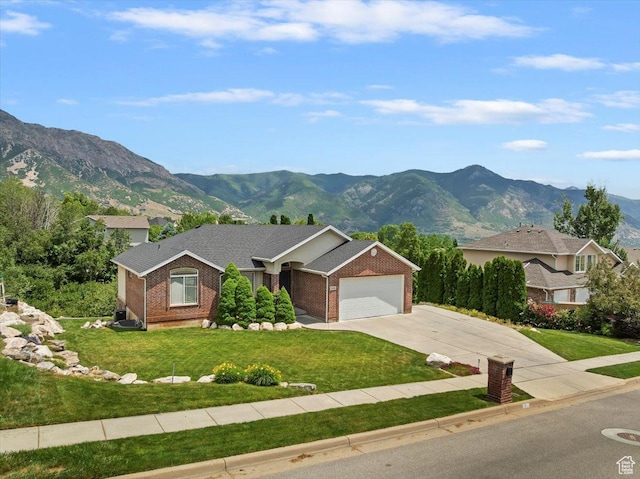 3634 N 225 E, North Ogden, UT 84414 - ranch-style house with a mountain view, an attached garage, driveway, brick siding, and a front yard