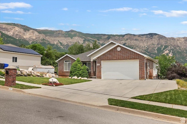 3634 N 225 E, North Ogden, UT 84414 - single story home with a mountain view, an attached garage, and brick siding