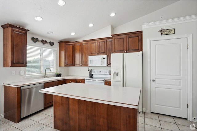 3634 N 225 E, North Ogden, UT 84414 - kitchen with white appliances, lofted ceiling, light tile patterned flooring, light countertops, and a kitchen island