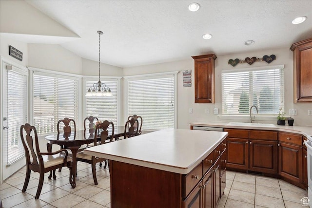 3634 N 225 E, North Ogden, UT 84414 - kitchen featuring light countertops, light tile patterned flooring, a chandelier, a kitchen island, and lofted ceiling