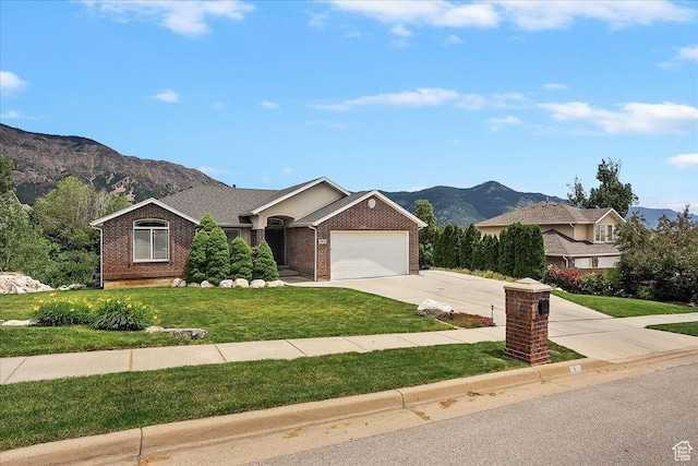 3634 N 225 E, North Ogden, UT 84414 - ranch-style house featuring a mountain view, brick siding, driveway, an attached garage, and a front lawn