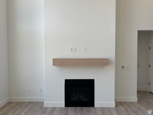 1678 S 130 W Unit 48, Salem, UT 84653 - detailed view of wood finished floors and a fireplace