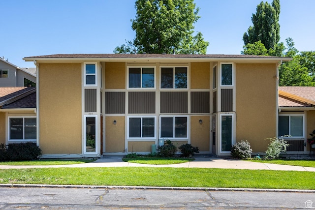 330 E Peach Ln, Bountiful, UT 84010 - view of front of home with stucco siding and a front lawn