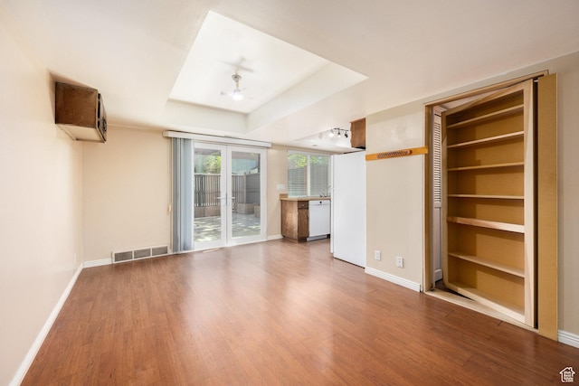 330 E Peach Ln, Bountiful, UT 84010 - unfurnished living room with wood finished floors, a tray ceiling, and ceiling fan