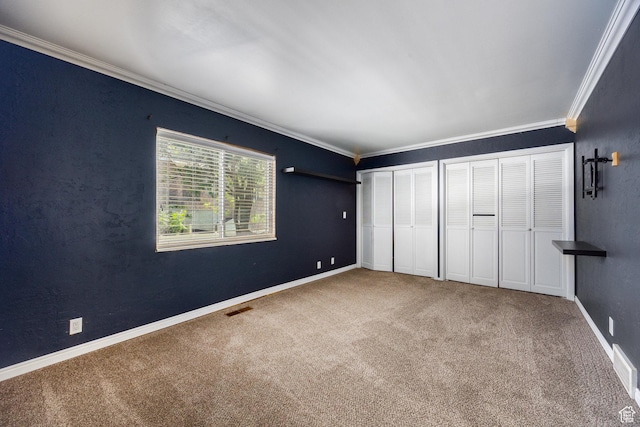 330 E Peach Ln, Bountiful, UT 84010 - unfurnished bedroom with crown molding, carpet flooring, and two closets