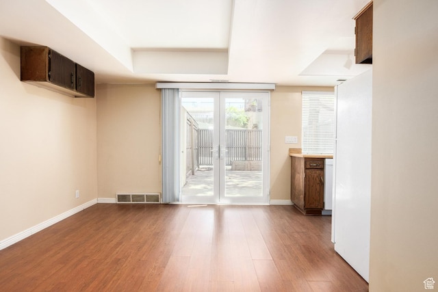 330 E Peach Ln, Bountiful, UT 84010 - unfurnished living room with wood finished floors, french doors, and a raised ceiling
