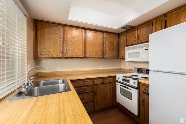 330 E Peach Ln, Bountiful, UT 84010 - kitchen with white appliances and brown cabinets