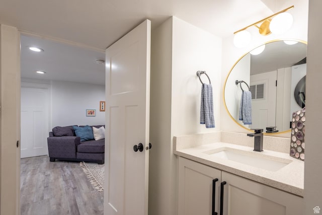 68 W 3600 S, Bountiful, UT 84010 - bathroom with vanity, wood finished floors, and recessed lighting