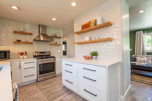 68 W 3600 S, Bountiful, UT 84010 - kitchen with stainless steel range with gas cooktop, wall chimney exhaust hood, open shelves, black microwave, and tasteful backsplash