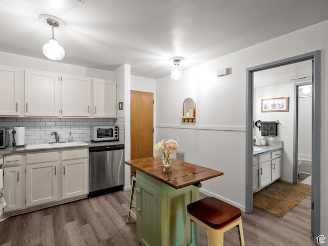 425 S 1000 E Unit 402C, Salt Lake City, UT 84102 - kitchen featuring appliances with stainless steel finishes, light wood finished floors, and white cabinets