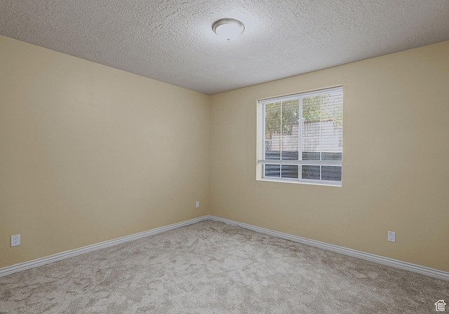 3903 S 3200 W, West Valley City, UT 84119 - carpeted spare room featuring baseboards and a textured ceiling