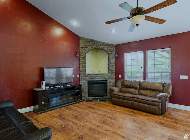3903 S 3200 W, West Valley City, UT 84119 - living room featuring wood finished floors, a ceiling fan, lofted ceiling, a fireplace, and recessed lighting