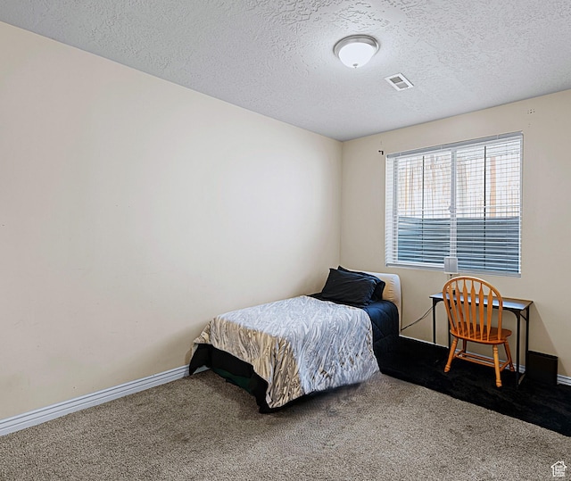 3903 S 3200 W, West Valley City, UT 84119 - carpeted bedroom featuring a textured ceiling and baseboards