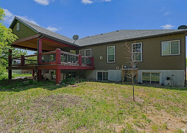 3903 S 3200 W, West Valley City, UT 84119 - rear view of property with a wooden deck, a lawn, and stucco siding