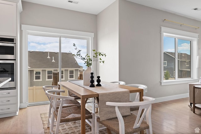3256 S Iron Hill Cir, Saratoga Springs, UT 84045 - dining area with plenty of natural light and light wood-style flooring
