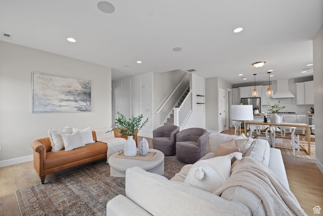 3256 S Iron Hill Cir, Saratoga Springs, UT 84045 - living room with stairway, light wood-type flooring, and recessed lighting