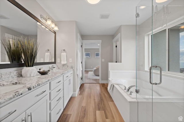 3256 S Iron Hill Cir, Saratoga Springs, UT 84045 - full bath with a garden tub, double vanity, wood finished floors, a shower stall, and ensuite bath