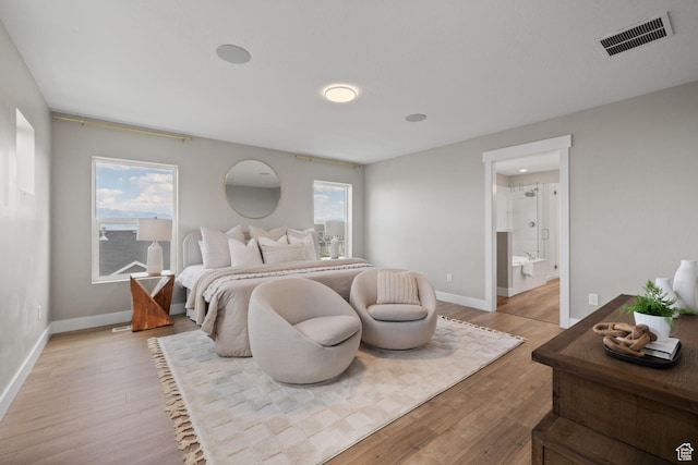 3256 S Iron Hill Cir, Saratoga Springs, UT 84045 - bedroom with light wood-style flooring, multiple windows, and ensuite bath